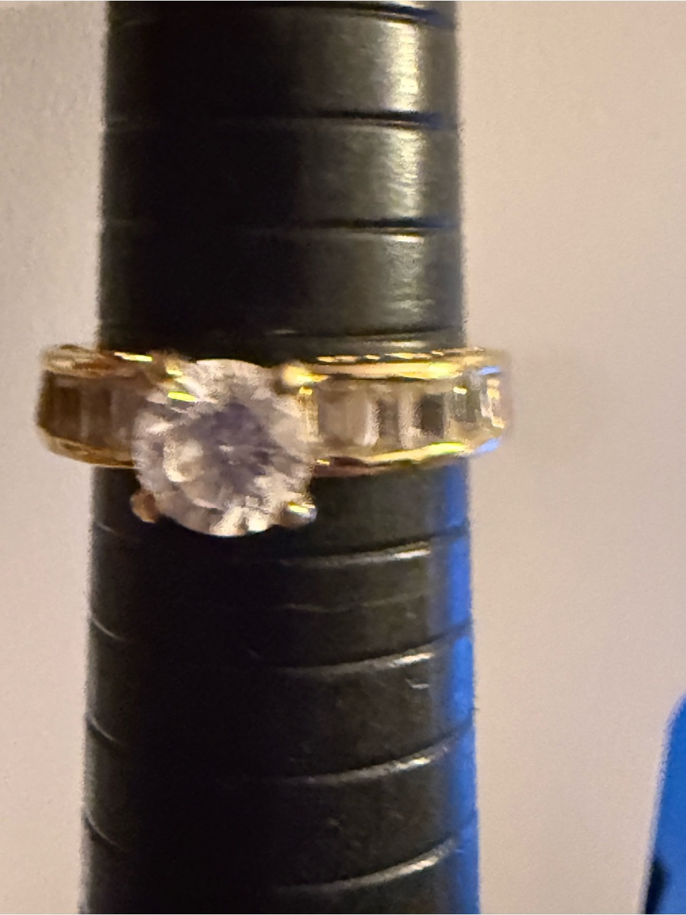 Gold tone Ring with Clear Round Center Stone and Baguette Accents